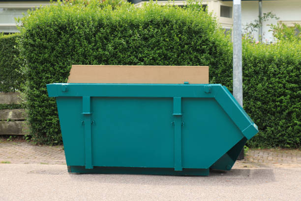 loaded dumpster near a construction site, a home renovation or maintenance