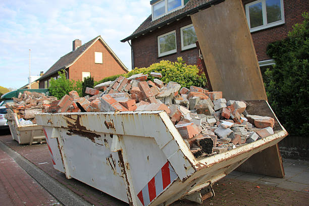 loaded dumpster near a construction site, home renovation