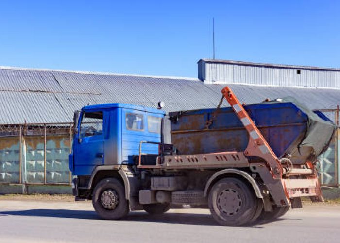 specialized car removes waste garbage from the streets of the city